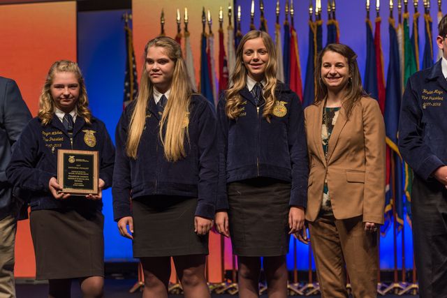 Middle School Models of Excellence Ginger Mitchell, Gracie Minyard, Abbie Gilbert and Advisor Anna Watkins were recognized on stage
